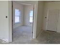 Spacious open-concept living space showcasing new construction elements and ample natural light at 3897 Berkdale Ct, Columbus, IN 47203