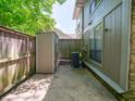 Enclosed outdoor space with privacy fence, storage shed, and HVAC unit on a concrete slab at 4268 Foxglove Trce, Indianapolis, IN 46237