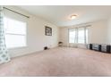 Well-lit living room with large windows and neutral color palette at 4712 Clairmont Dr, Columbus, IN 47203