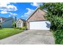 Charming single-story home with attached garage and driveway at 4824 Eagles Watch Ln, Indianapolis, IN 46254