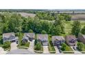 Neighborhood aerial view showcasing multiple homes, green spaces, and residential layout at 5145 Greenside Dr, Indianapolis, IN 46235