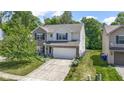 Well-maintained home with a two-car garage, green lawn, and appealing design elements at 5145 Greenside Dr, Indianapolis, IN 46235