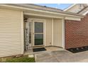 Charming home entrance featuring a glass door and sidelight, with a welcome sign adding a warm touch at 5503 Wilder Way, Indianapolis, IN 46216