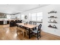 Bright dining room with a large window, hardwood floors, and modern decor at 609 E 39Th St, Indianapolis, IN 46205