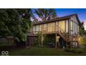 Rear exterior features a walkout deck, screened porch and partially-wooded lot at 659 Carson Ct, Carmel, IN 46033