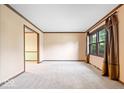 Bright and airy living room with neutral carpet and trim at 659 Carson Ct, Carmel, IN 46033