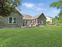 A spacious yard with a patio featuring outdoor seating at 6693 W May Apple Dr, McCordsville, IN 46055
