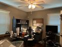 A functional bedroom offers a dedicated workspace, ideal for work or study, with ample storage and natural light at 670 Van Ave, Shelbyville, IN 46176