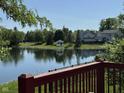 Picturesque lake view with a charming gazebo, enhancing the community's appeal at 7970 Cobblesprings Dr, Avon, IN 46123