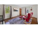 Inviting living room featuring hardwood floors, natural light, and a comfortable seating area at 909 E Markwood Ave, Indianapolis, IN 46227