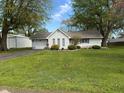 Charming single-story home with manicured front yard and driveway at 1011 N 10Th St, Elwood, IN 46036