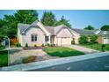 Charming brick home with well-maintained landscaping, featuring a two-car attached garage at 12258 Charing Cross Rd, Carmel, IN 46033