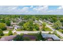 Picturesque aerial view of a quiet residential neighborhood, featuring lush green trees and well-maintained homes at 1416 Miami S Ct, Plainfield, IN 46168