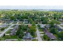 Picturesque aerial view of a quiet residential neighborhood, featuring lush green trees and well-maintained homes at 1416 Miami S Ct, Plainfield, IN 46168