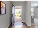 Inviting foyer with hardwood floors and a view of the front yard at 19657 Astoria Ave, Sheridan, IN 46069