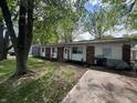 Charming single-story brick home with a well-maintained lawn and inviting front entrance at 2015 Rosewood Dr, Anderson, IN 46011