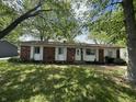 Charming single-story brick home with a well-maintained lawn and inviting front entrance at 2015 Rosewood Dr, Anderson, IN 46011