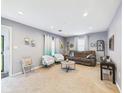 Spacious living room featuring carpeting, furniture, neutral paint, decor, and windows at 2353 E 10Th St, Anderson, IN 46012