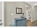 Stylish entryway featuring a modern cabinet, tasteful decor, and hardwood floors at 247 Verdant Dr, Cicero, IN 46034