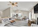 Open-concept living room with a view into the kitchen and dining area at 247 Verdant Dr, Cicero, IN 46034
