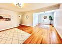 Light-filled living room with hardwood floors and minimalist decor at 4714 Crestview Ave, Indianapolis, IN 46205
