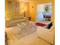Inviting living room with stylish furnishings, neutral decor, and an open layout leading to the dining area at 6056 Blackley Ct, Indianapolis, IN 46254