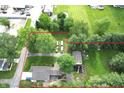 An aerial view of a house lot with a red outline, showing a well-maintained lawn and mature trees at 71 W County Road 500 S, Clayton, IN 46118