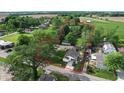 A home surrounded by lush trees and greenery in a rural area, defined with a red perimeter line at 71 W County Road 500 S, Clayton, IN 46118
