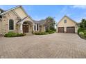 Attractive home featuring a circular driveway, well-maintained landscaping, and stone and shingle facade at 860 Chatham Hills Blvd, Westfield, IN 46074