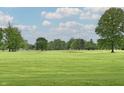 Scenic view of a lush green golf course with mature trees and blue skies at 9098 W 1050 N, Elwood, IN 46036