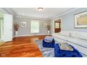 Inviting living room with hardwood floors and light gray walls, exuding warmth and charm at 10627 Indian Lake S Blvd, Indianapolis, IN 46236