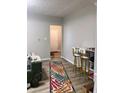 Cozy living room with a colorful rug, bar stools and pet cat at 1114 N Olney St, Indianapolis, IN 46201