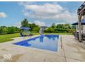 Inviting backyard pool with slide, perfect for summer fun and relaxation at 11521 Willow Bend Dr, Zionsville, IN 46077