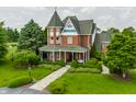 View of this Victorian home with mature landscaping, stone walkway, and manicured lawn at 11705 N Shelby 700 W, New Palestine, IN 46163