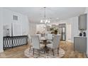 Elegant dining area with a round table, seating for six, and views of the modern kitchen at 14866 E Keenan Cir # Lot 38, Westfield, IN 46074