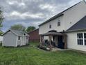 A quaint backyard with a patio, gazebo, shed and playset at 1713 Williamsburg Cir, Franklin, IN 46131