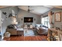 Cozy living room with vaulted ceilings, hardwood floors, and comfortable seating at 1713 Williamsburg Cir, Franklin, IN 46131