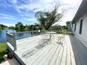 Inviting wooden deck overlooking a serene lake view, perfect for outdoor relaxation at 199 Fountain Lake S Dr, Shelbyville, IN 46176