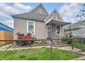 Home with a cozy front porch, tidy front yard, and an inviting entrance at 2006 N Olney St, Indianapolis, IN 46218