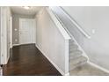 Bright foyer with hardwood floors, a staircase, and natural light, offering a grand entrance at 220 Sawdust Trl, Greenfield, IN 46140