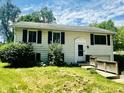 Charming two-story home with black shutters and well-maintained landscaping at 2419 Tamarack Pl, Anderson, IN 46011