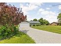 A single story home featuring an attached one-car garage and long gravel driveway at 3020 E 400 S, Lebanon, IN 46052