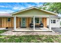 Inviting front porch with a seating area and welcome decor creates a warm and welcoming first impression at 356 Daugherty St, Columbus, IN 47201