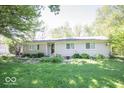 Charming single-story home with a well-maintained lawn and mature trees, offering great curb appeal at 4023 Cedar Hills South Dr, Greenwood, IN 46143
