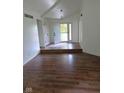 Bright entryway featuring wood-look floors and a welcoming front door at 4115 Tansel Rd, Indianapolis, IN 46234