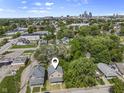 Aerial view of neighborhood with the subject home. Locator pin indicates exact location. Kansas City skyline in distance at 418 Harlan St, Indianapolis, IN 46201