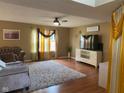 Cozy living room with hardwood floors, plush rug, and elegant decor at 5241 Waterton Lakes Dr, Indianapolis, IN 46237