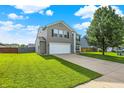 Attractive home boasting well-kept landscaping, a driveway, and a lush green lawn at 5517 Jona Way, Bargersville, IN 46106