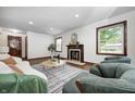 Bright living room with hardwood floors, fireplace, neutral colors, and comfortable seating at 5809 N Illinois St, Indianapolis, IN 46208