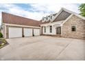 Home features a three car garage and long driveway at 720 Willow Pointe North Dr, Plainfield, IN 46168